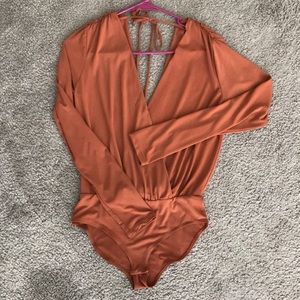 Burnt orange body suit